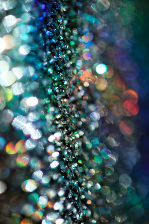 reflections of light multi color on the rough metal surface, for blurred backgroundの写真素材
