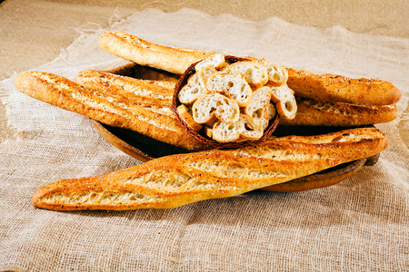 bread with seeds on the wooden plateの写真素材