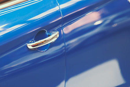 door handles of cars with door lock, note shallow depth of fieldの写真素材