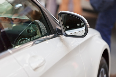 rearview mirror on the motor vehicle, note shallow depth of fieldの写真素材
