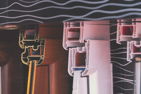 cross-section aluminum window frames on a colorful background , note shallow depth of fieldの写真素材