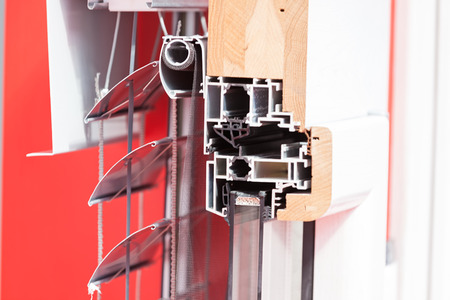 lateral cross-section aluminum frame windows with  mehanism for shutters, note shallow depth of fieldの写真素材