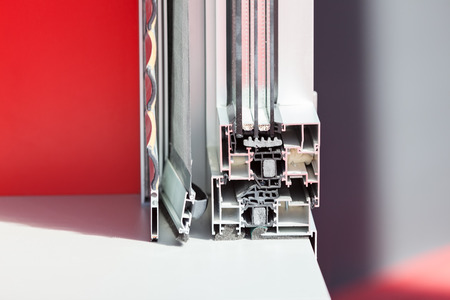 lateral cross-section aluminum frame windows with  mehanism for shutters, note shallow depth of fieldの写真素材