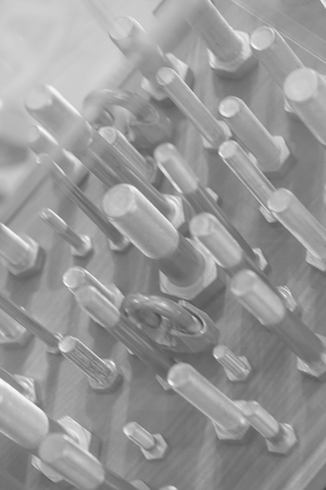 screws, nuts, clamps ...on the glass, note shallow depth of fieldの写真素材