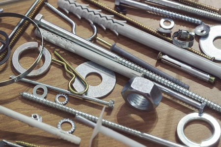 screws, nuts, clamps ...on the glass, note shallow depth of fieldの写真素材