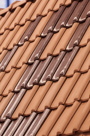 types of red tiles for roof  to cover the house, note shallow depth of fieldの写真素材