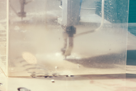 cnc water jet machine for  metalworking, note shallow depth of fieldの写真素材