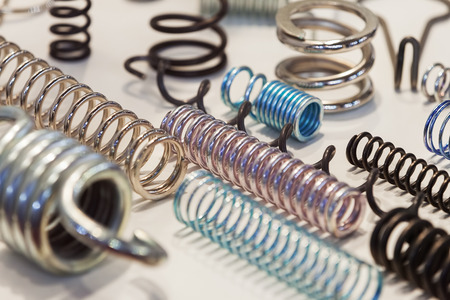 Various metal springs for different purposes, note shallow depth of fieldの写真素材
