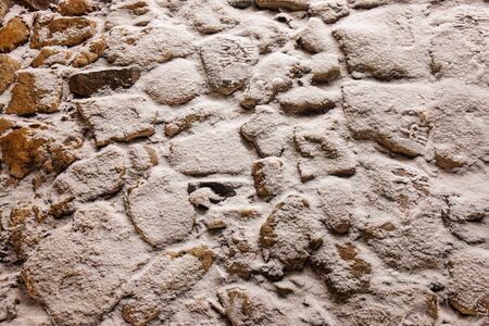 Trail of stone under the snowの写真素材