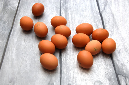 A chicken egg lies in a shipping box and is sold at the supermarket. decorative egg