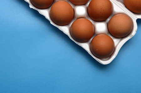 A chicken egg lies in a shipping box and is sold at the supermarket. decorative eggの写真素材