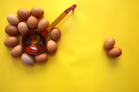 A chicken egg lies in a shipping box and is sold at the supermarket. decorative egg