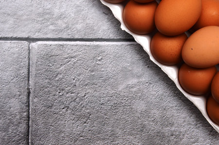 A chicken egg lies in a shipping box and is sold at the supermarket. decorative egg