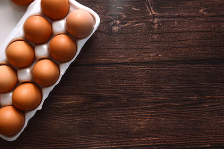 A chicken egg lies in a shipping box and is sold at the supermarket. decorative egg