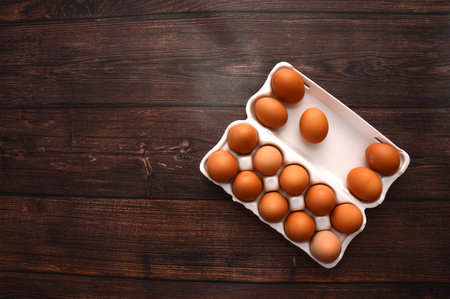 A chicken egg lies in a shipping box and is sold at the supermarket. decorative egg