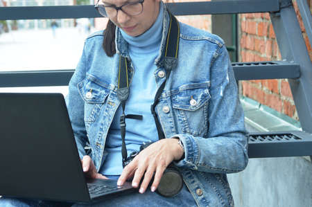 Girl freelancer performs the taskの写真素材