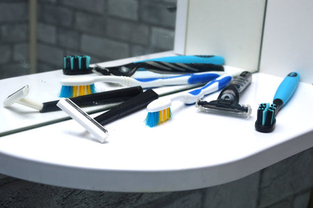 toothbrush and razor in the bathroomの写真素材