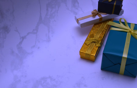 Gift boxes with ribbons on a blue background. copyspace.