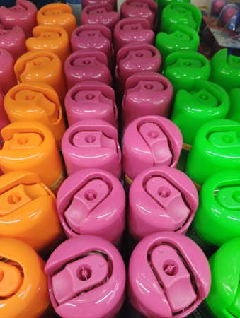 Colorful plastic cans in a store, close-up of photoの写真素材