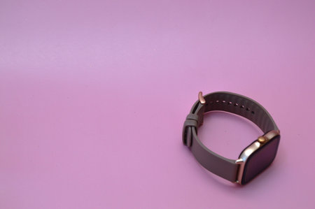 Fitness bracelet on a pink background. Fitness bracelet on a pink background.の写真素材