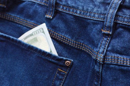 Dollars in the pocket of jeans. close-up.の写真素材
