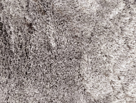 Close up of gray fluffy carpet texture. Abstract background and texture for design.