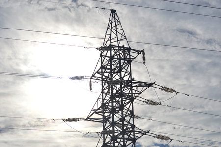 high voltage post. High voltage tower sky background. Electricity distribution station.