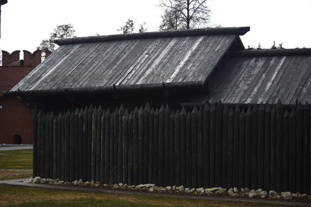 Old wooden fence and walls of the Kremlin in Tallinn, Estoniaの写真素材
