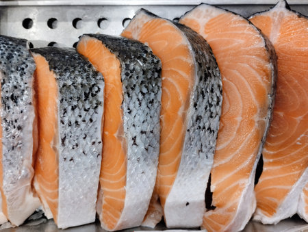 Salmon fillets on display in a seafood market, close upの写真素材