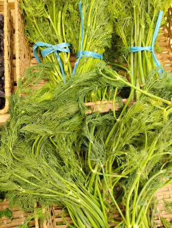 Fresh dill in baskets on the market. close-up.の写真素材