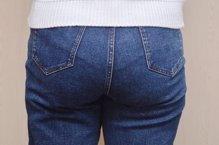 Female buttocks in jeans close-up. The concept of weight loss.の写真素材