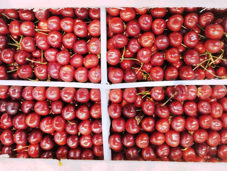 Cherries on display at a farmers market, closeup of photoの写真素材