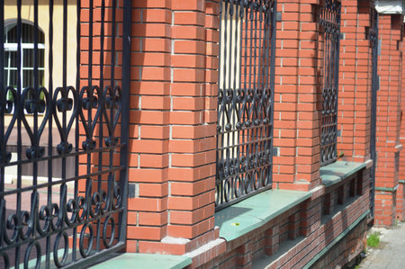 Iron fence on the facade of the building, close-up.の写真素材