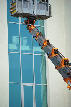 Industrial crane on the background of the building. industrial background.