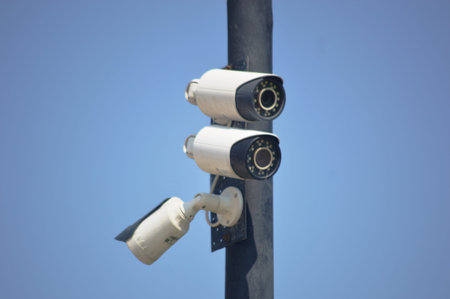 CCTV security camera with blue sky background. security camera on field.