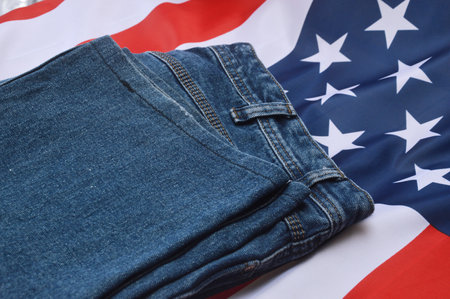 Blue jeans on the background of the American flag. close-upの写真素材