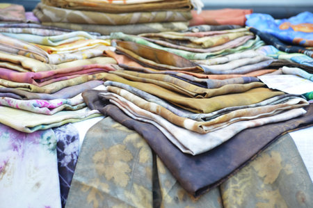 colorful fabrics for sale in the market, closeup of photo