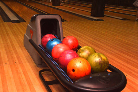 Bowling balls in bowling alley, closeup of photo with shallow depth of fieldの写真素材