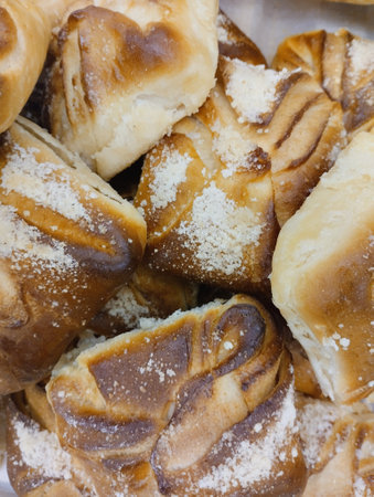 Close up of freshly baked buns with sugar powder. selective focus.の写真素材