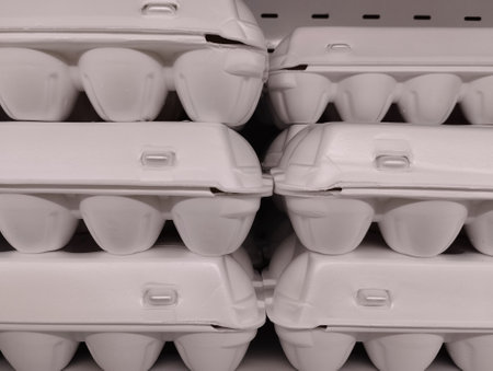 Pile of white plastic food containers in supermarket, closeup of photoの写真素材