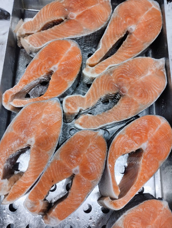 Fresh salmon steaks on the grill in the restaurant in winter.の写真素材