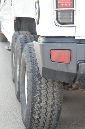 Rear view of a white off-road vehicle in a row.