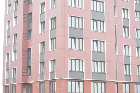 Multi-storey building in the city. Facade of a modern apartment buildingの写真素材