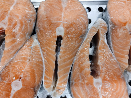 Close up of fresh salmon fillet on ice in the market.