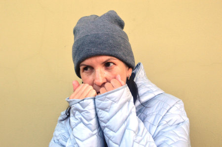 Portrait of a middle aged woman in a winter jacket and hat