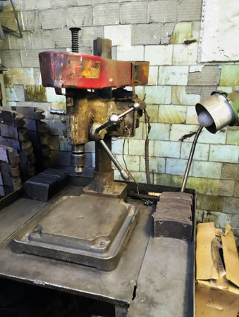 Old lathe machine in a factory, closeup of photo.