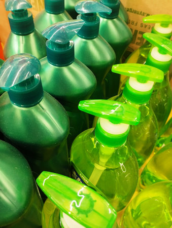Plastic bottles with liquid soap for cleaning the face and body.
