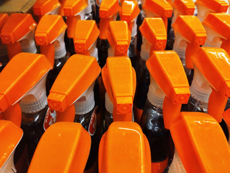 Orange plastic bottles in a row, close-up. industrial backgroundの写真素材