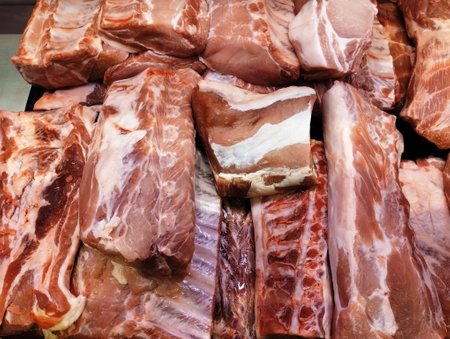 Raw pork ribs on display in a butcher shop. Close-up.の写真素材