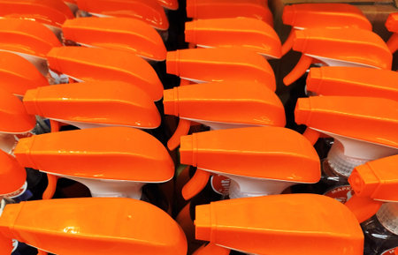 Orange safety helmets in a store, ready to be used as a background